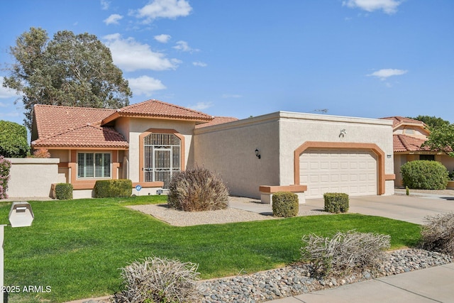 mediterranean / spanish home featuring stucco siding, concrete driveway, a front yard, a garage, and a tiled roof