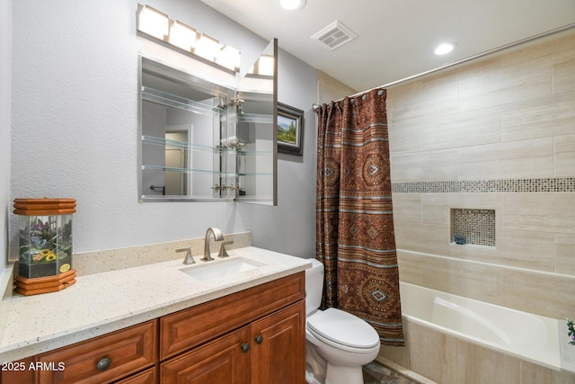 bathroom with visible vents, a textured wall, toilet, shower / bath combo with shower curtain, and vanity