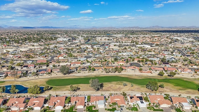 aerial view with a residential view, a mountain view, and golf course view