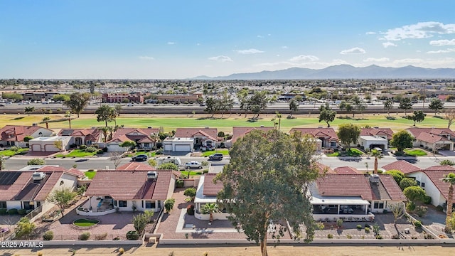 drone / aerial view featuring a residential view and a mountain view