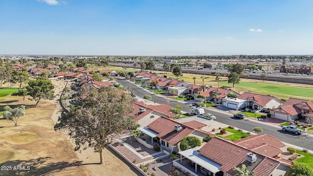 drone / aerial view featuring a residential view and golf course view