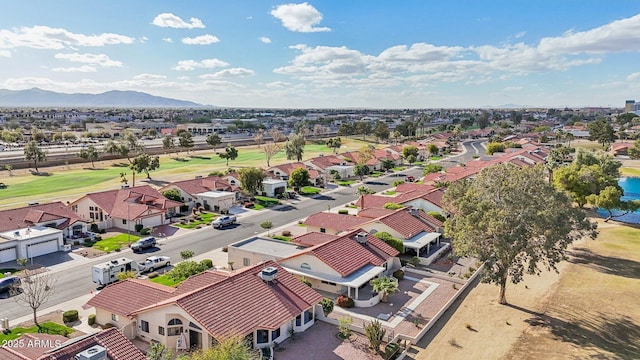 birds eye view of property with a residential view, a mountain view, and golf course view