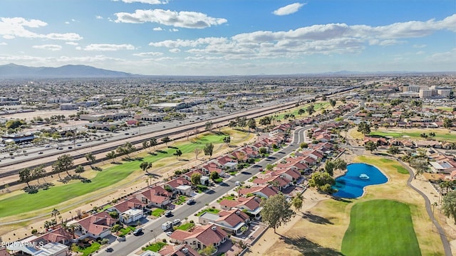 birds eye view of property featuring a residential view, golf course view, and a water and mountain view