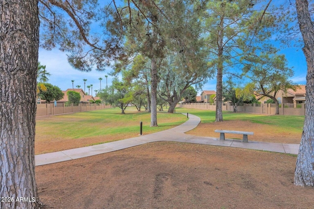 view of property's community featuring a yard