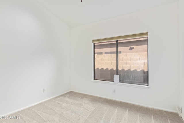 unfurnished room with light carpet