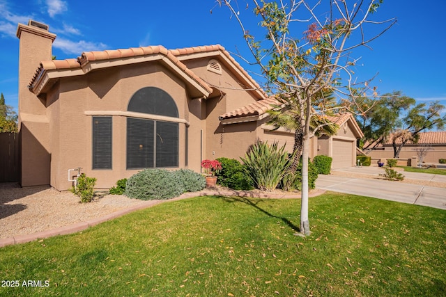 mediterranean / spanish-style house with a garage and a front yard