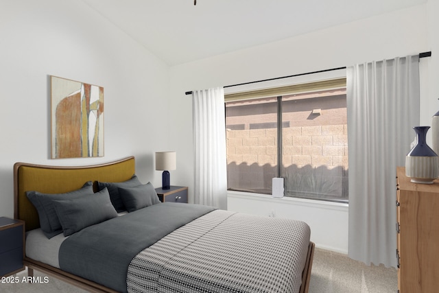 carpeted bedroom featuring vaulted ceiling