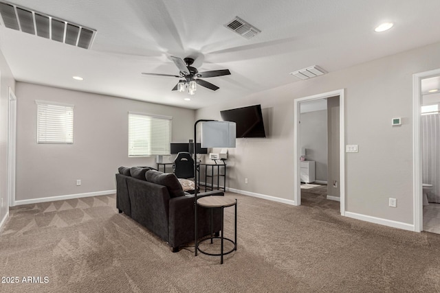 living room featuring ceiling fan and carpet flooring