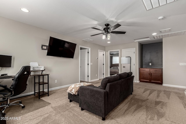 carpeted living room featuring ceiling fan