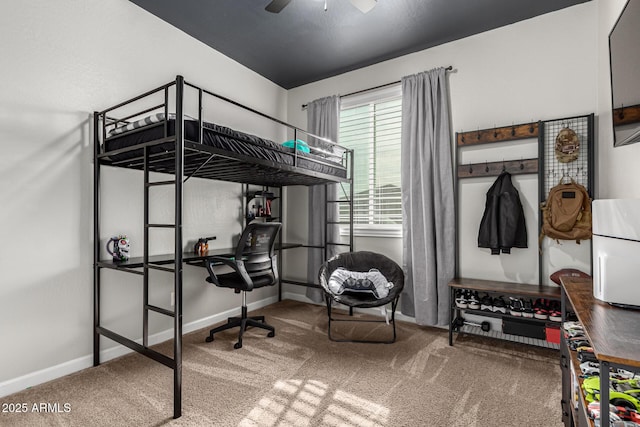 bedroom featuring ceiling fan and carpet