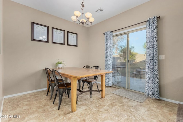 dining area featuring a chandelier, visible vents, and baseboards