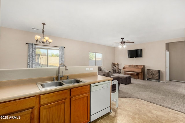 kitchen with light countertops, light colored carpet, open floor plan, white dishwasher, and a sink