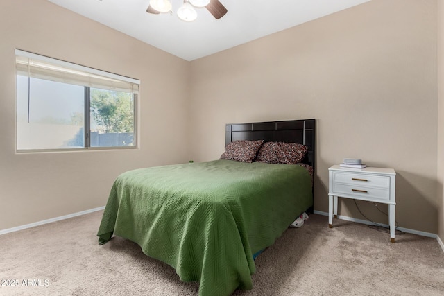 bedroom with carpet, a ceiling fan, and baseboards