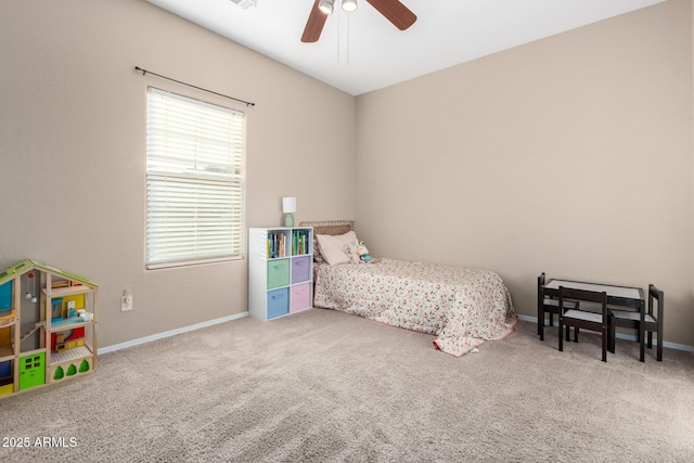 carpeted bedroom with a ceiling fan and baseboards