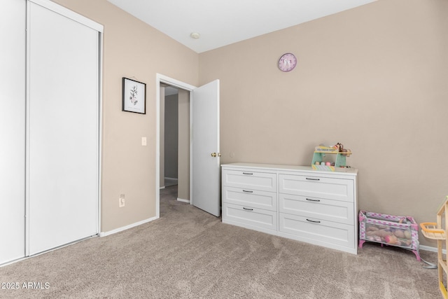 unfurnished bedroom with carpet floors and baseboards