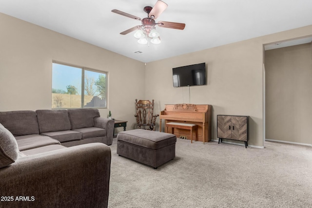 living room featuring light carpet, visible vents, baseboards, and a ceiling fan