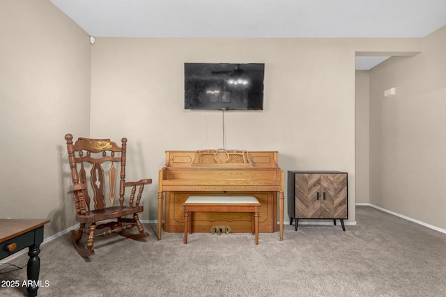 living area with baseboards and carpet flooring