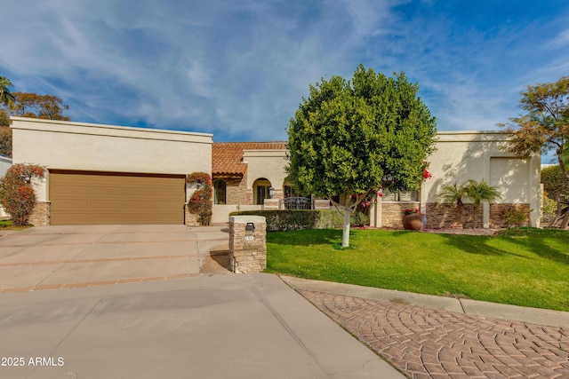 mediterranean / spanish-style home featuring a garage, concrete driveway, a front lawn, and stucco siding