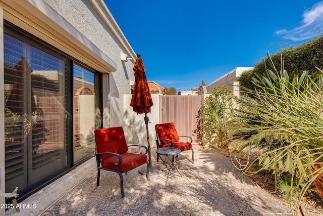 view of patio / terrace featuring fence