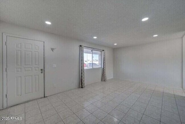 empty room featuring recessed lighting
