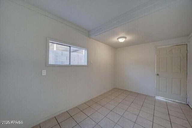 unfurnished room featuring light tile patterned floors