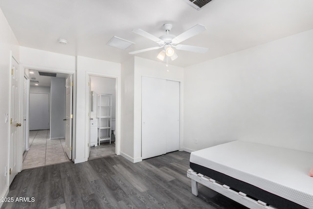 bedroom with ceiling fan and dark hardwood / wood-style flooring