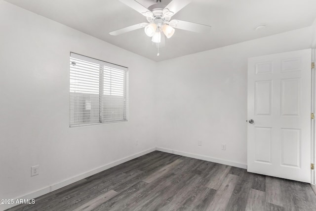 unfurnished room with ceiling fan and dark hardwood / wood-style floors