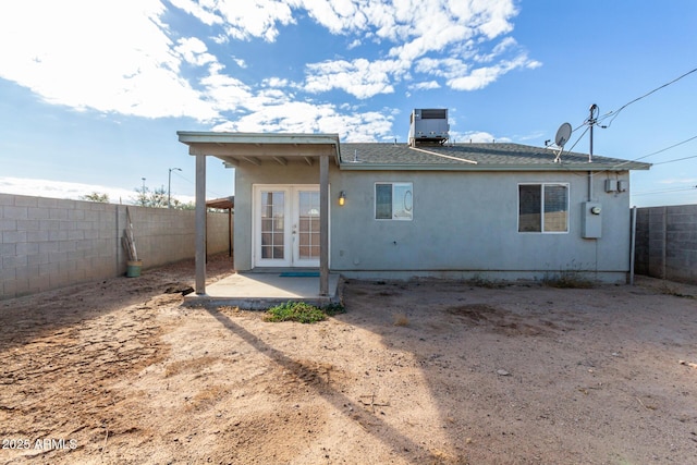 back of house featuring a patio, french doors, and central air condition unit