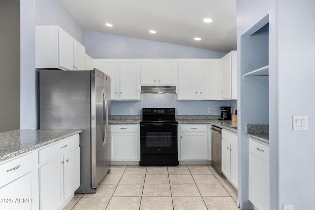 kitchen with light tile patterned flooring, vaulted ceiling, white cabinets, light stone counters, and stainless steel appliances