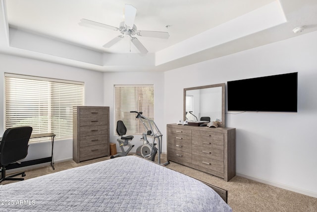 14000 N 94th St N Unit 1129, Scottsdale, AZ 85260 - bedroom featuring a tray ceiling, carpet floors, a desk, and ceiling fan