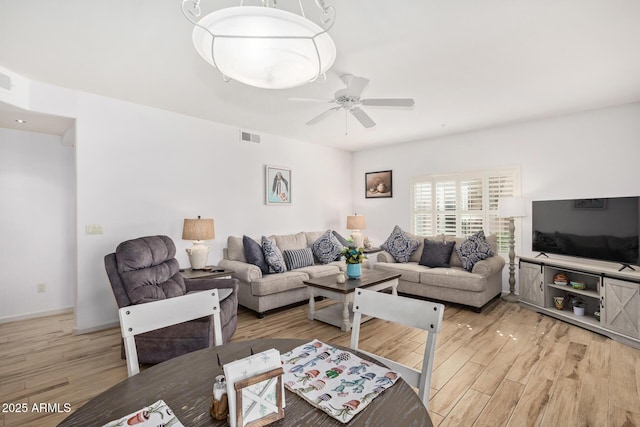 14000 N 94th St N Unit 1129, Scottsdale, AZ 85260 - living area featuring light wood finished floors and a ceiling fan