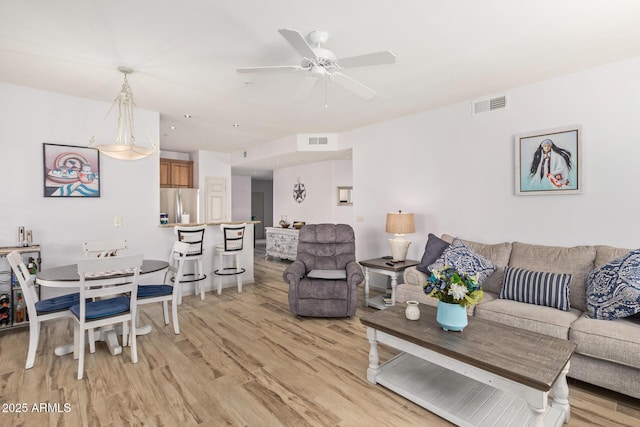 14000 N 94th St N Unit 1129, Scottsdale, AZ 85260 - living area with light wood finished floors and ceiling fan