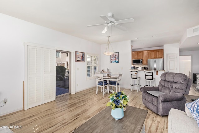14000 N 94th St N Unit 1129, Scottsdale, AZ 85260 - living area with light wood-style flooring and ceiling fan