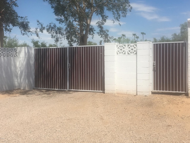 view of gate featuring fence