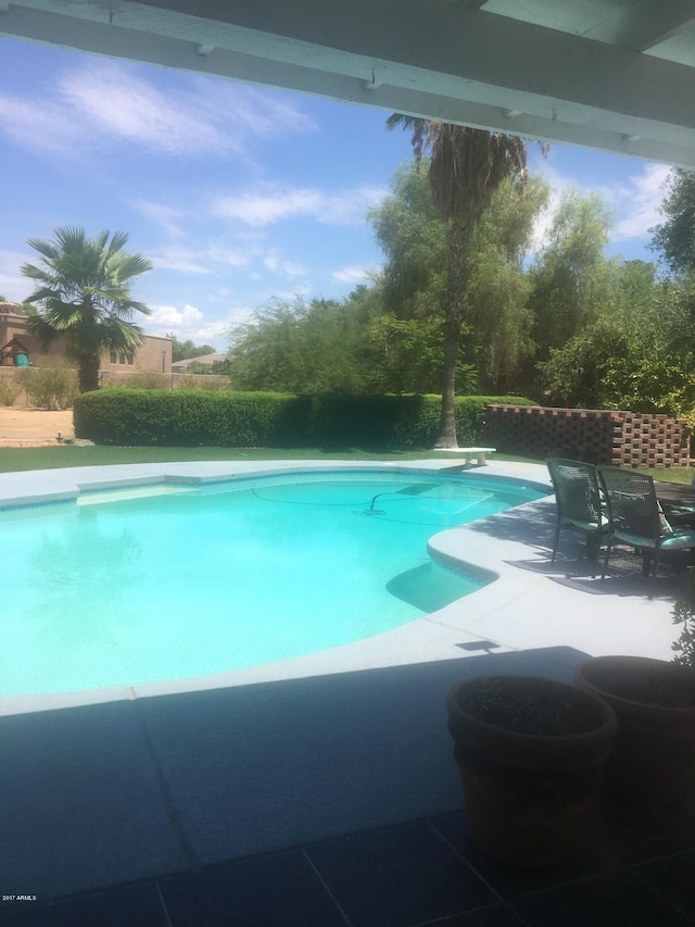 view of pool with a fenced in pool and a patio area