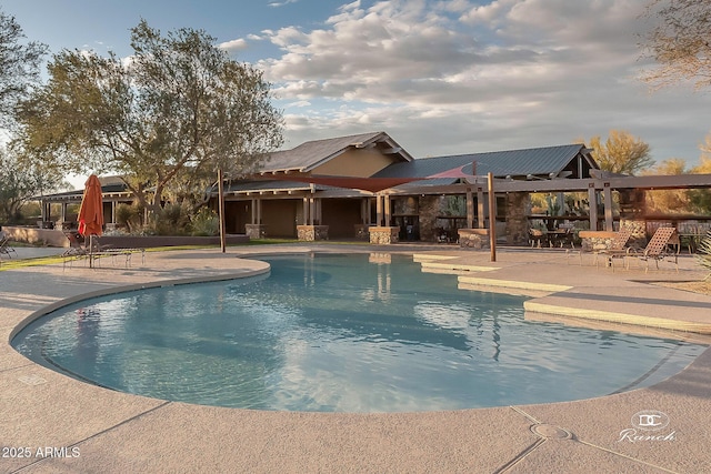 pool with a patio area