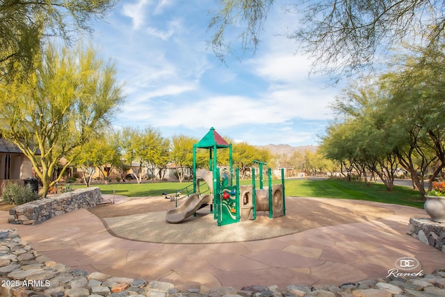 communal playground featuring a yard