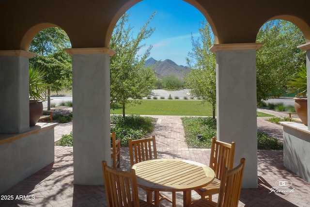view of patio / terrace featuring a mountain view