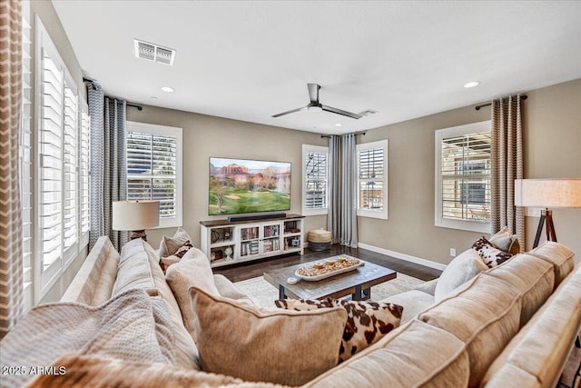 living room featuring visible vents, baseboards, ceiling fan, wood finished floors, and recessed lighting