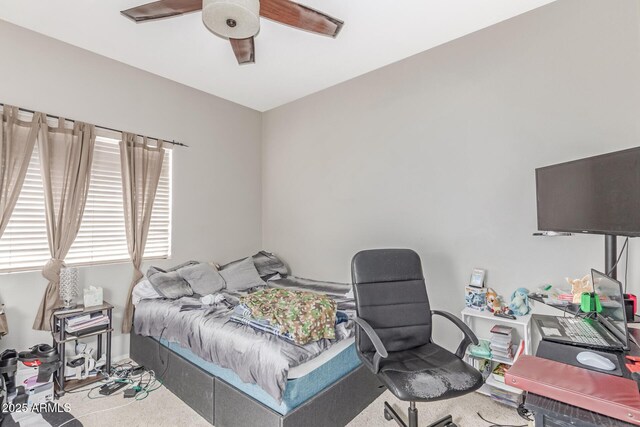 bedroom with ceiling fan and carpet flooring