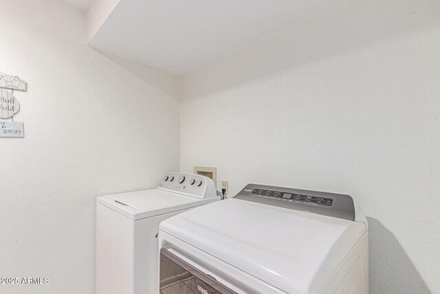 washroom with laundry area and washing machine and clothes dryer