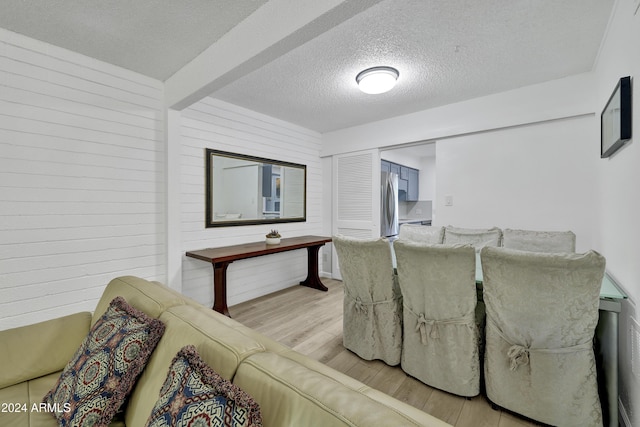 interior space featuring light hardwood / wood-style floors and a textured ceiling