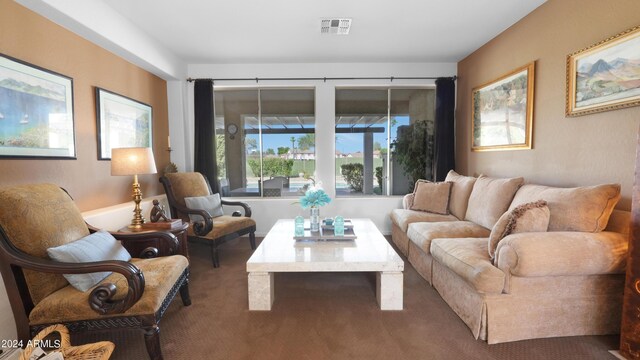 sitting room featuring light carpet