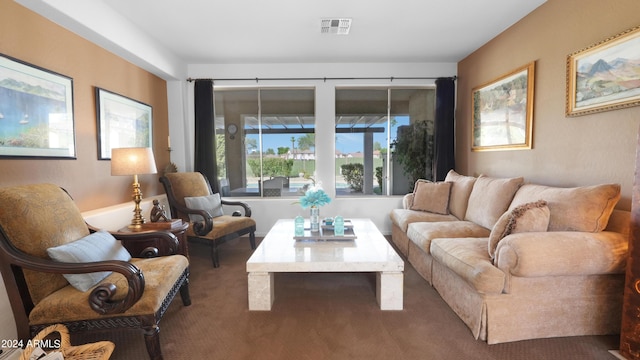 living room with carpet and visible vents