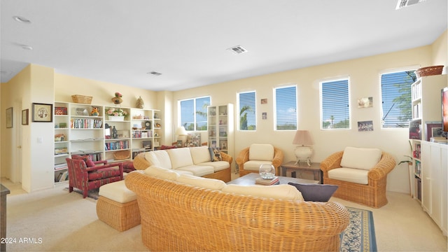 living room with light colored carpet and visible vents