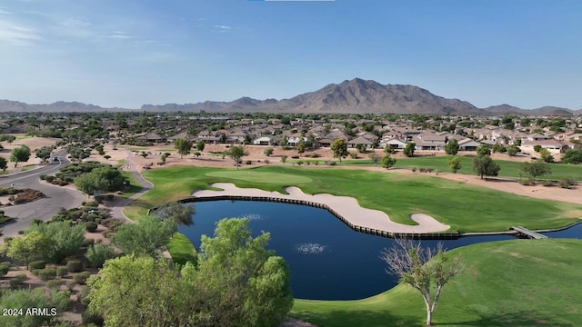 view of property's community featuring view of golf course, a residential view, and a water and mountain view