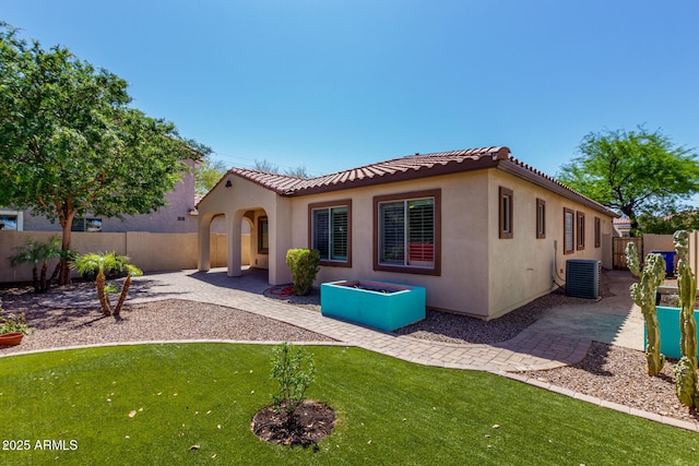 7159 S Dodane Ct, Gilbert, AZ 85298 - back of house with a patio, a fenced backyard, central AC unit, and a tile roof