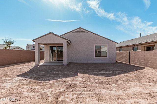 rear view of house featuring a patio