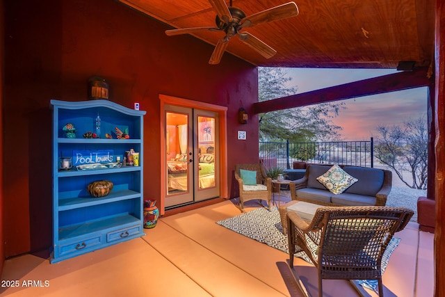 patio terrace at dusk featuring outdoor lounge area, ceiling fan, and french doors