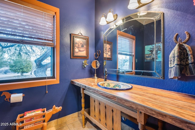 bathroom with tile patterned floors